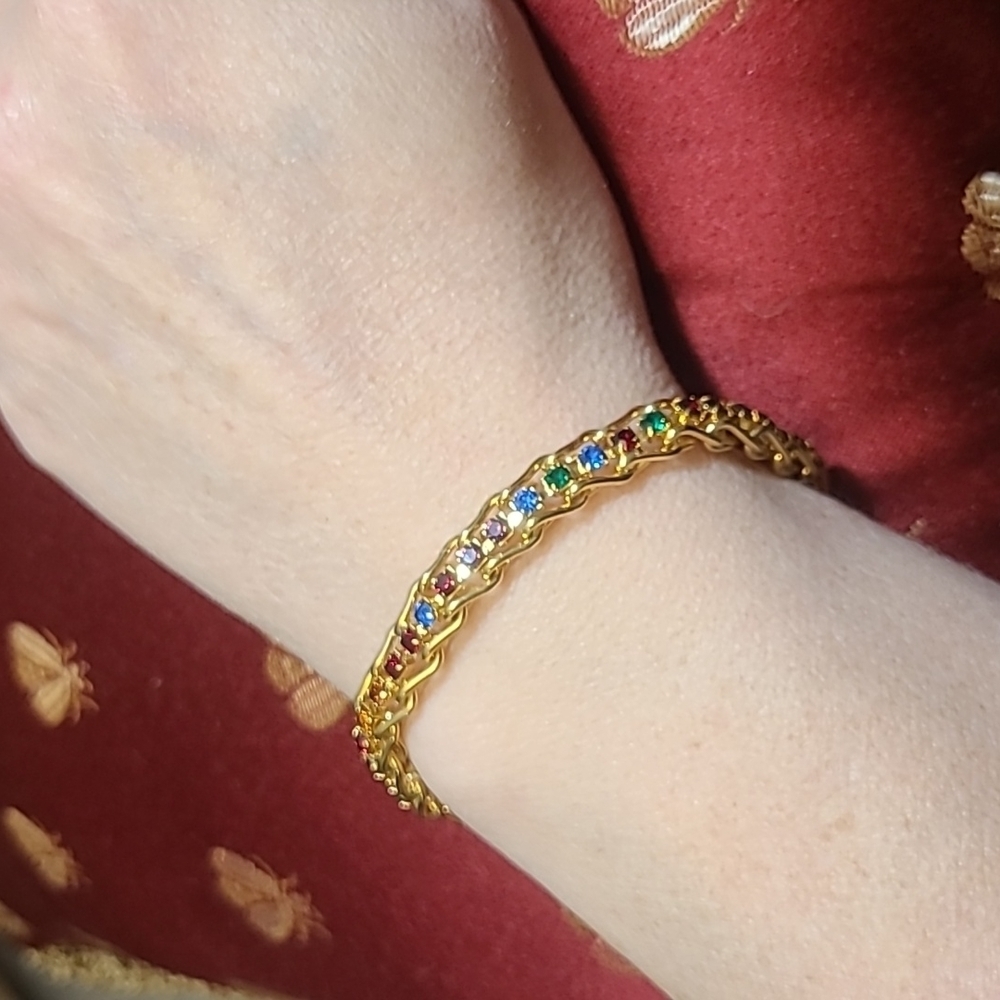 Gold tone bracelet with multi colored faux stones